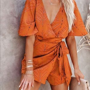 Orange Romper NWT.